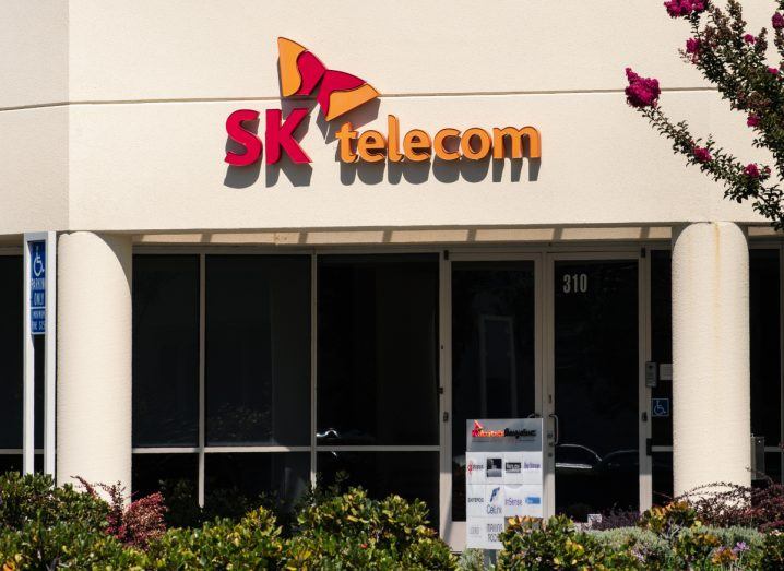 SK Telecom logo on a building on a sunny day.