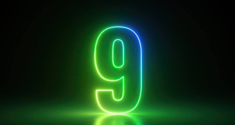 Neon number nine in green and blue on a black background.