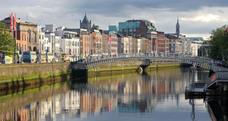 An image of Dublin city with a river and bridge visible in the image.
