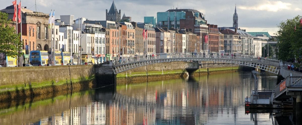 An image of Dublin city with a river and bridge visible in the image.