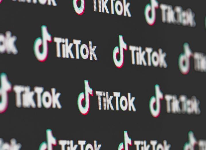 An image full of the TikTok logo on a black background.