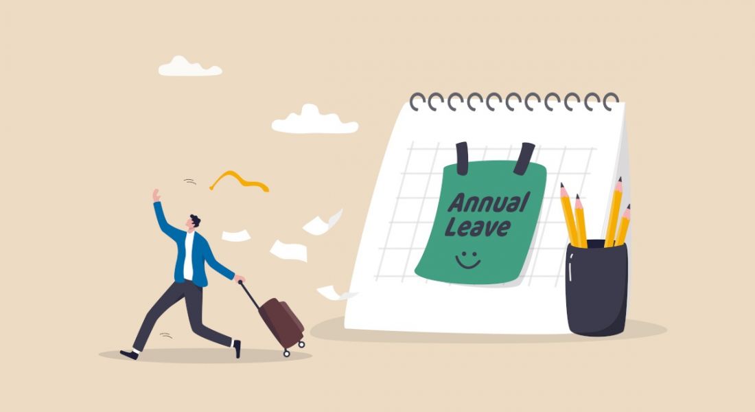 An illustration of a man walking away happily from a giant calendar while pulling a suitcase behind him. There is a note on the calendar that says 'Annual Leave'.